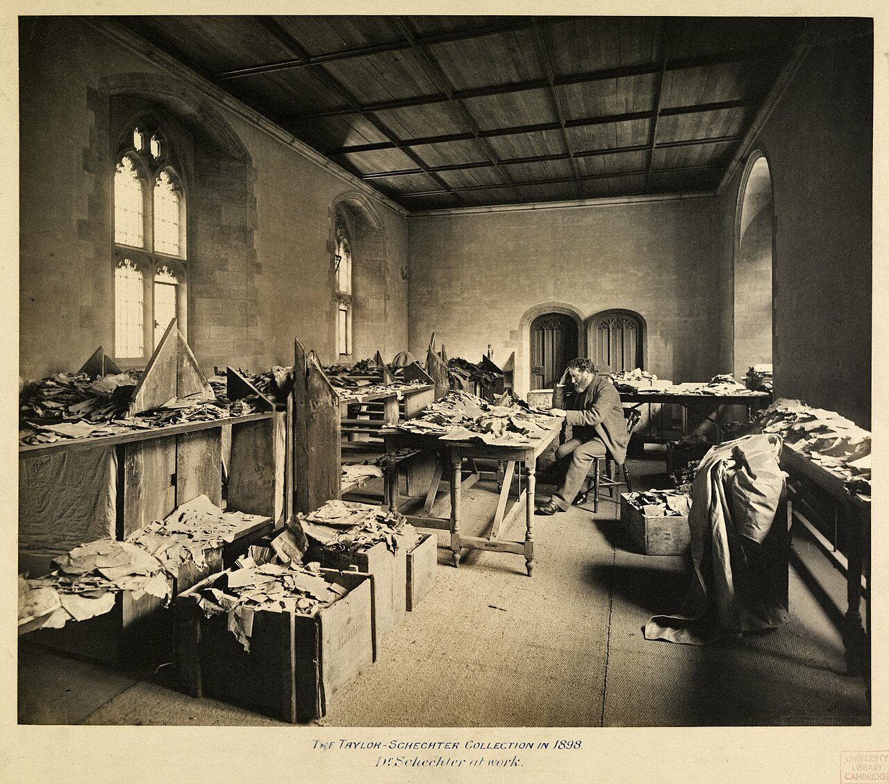 Solomon Schechter studying Cairo Geniza fragments, c.1898.