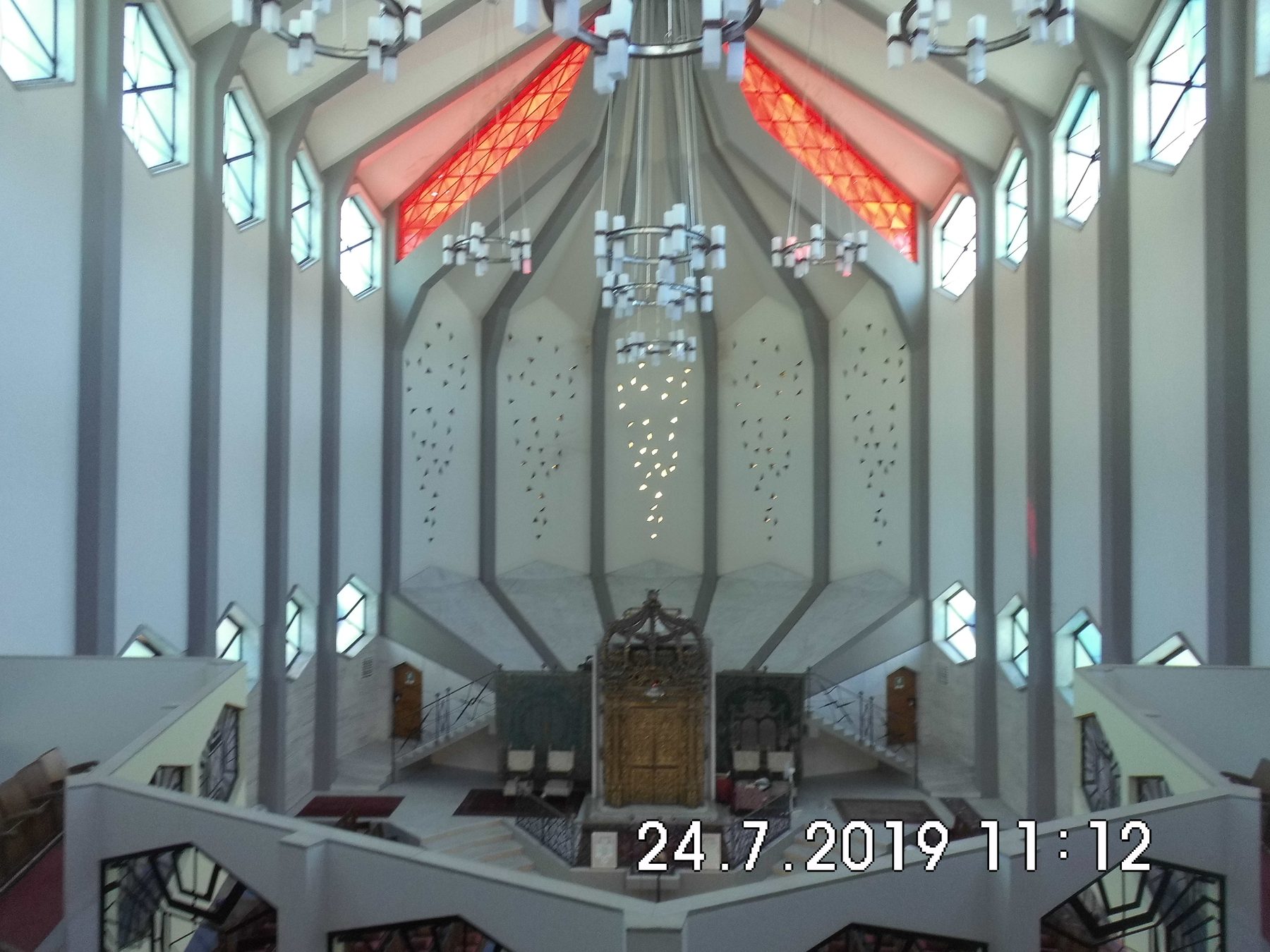 Interior of the modernist Great Synagogue of Livorno, rebuilt in 1962, looking towards the salvaged historic gilded ark